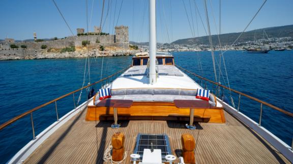 Enjoy the view of Bodrum's fortress from the cozy deck lounge of Gulet Ya Selam.