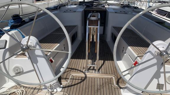 The helm area of the Taurus 6 yacht features spacious seating and dual wheels.