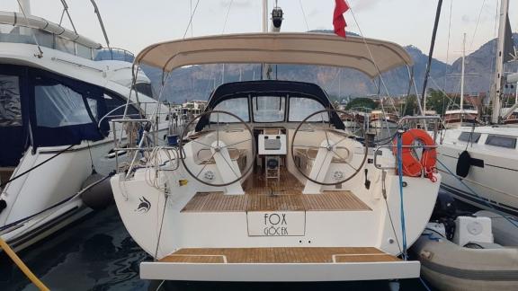 The steering area of the Fox sailing yacht anchored in the harbor, ready for cruising.