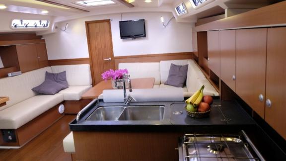 The interior of the Fox yacht offers comfort with a spacious seating area and galley.