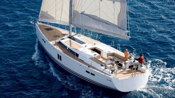 The sailing yacht Procyon showcases a comfortable deck design while sailing on the blue seas.