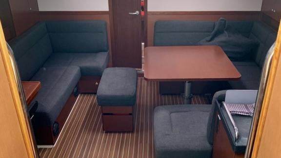 The saloon of the Procyon sailing yacht features a comfortable seating area and elegant design.