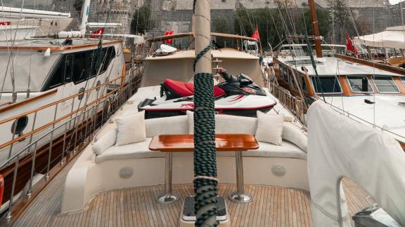 Front deck of the gulet Happy Hours with jet skis and seating.