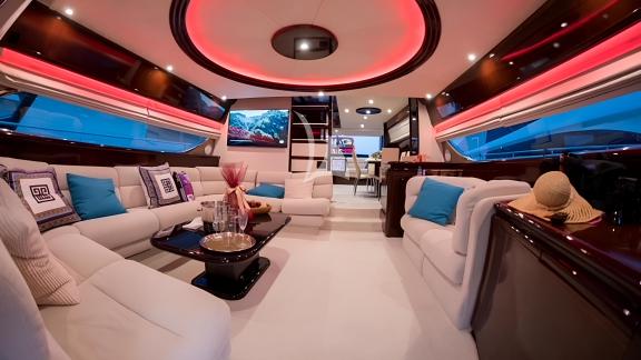 Luxurious interior salon area of the Hasard yacht with modern seating and stylish decor.