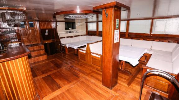 The inviting interior of the Gulet Holiday X in Fethiye, equipped with comfortable seating. The yacht has 10 cabins.