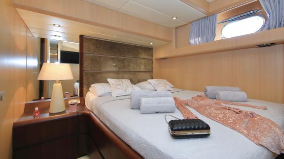 Modern double bedroom on Hope I yacht, with luxurious and comfortable details.