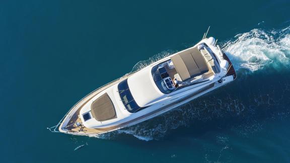 Aerial view of the Hope I yacht cruising on blue waters.