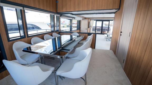 The elegant dining area of Almila motor yacht in Marmaris features a modern table and comfortable chairs.