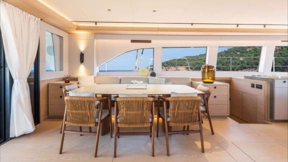 Lagoon Eighty2 catamaran Imladris offers a stylish dining space surrounded by panoramic windows.