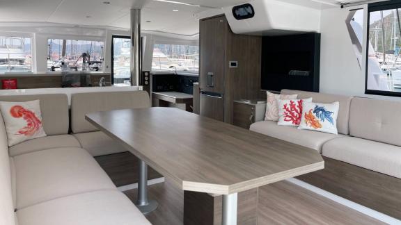 Stylish dining area in the salon of Bali 4.2 Catamaran Bella II, perfect for comfortable meals on board.