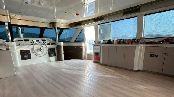 The interior helm of Angelo 3 features large windows and a modern design.