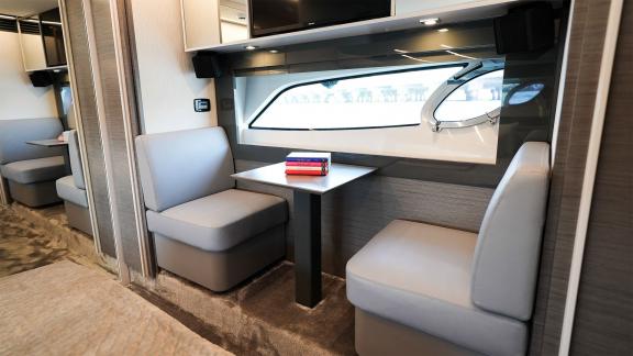 Enjoy the elegant seating and work space of Pershing 5X Grey with luxury yacht rental in Dubai.