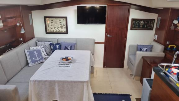 The saloon area of the Princess Ela yacht offers a stylish and comfortable setting for a relaxing time at sea.