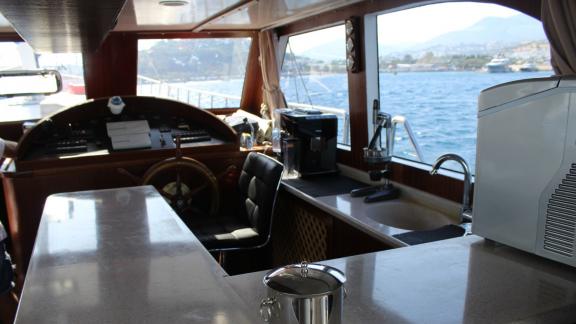 The helm station and well-equipped galley on Gulet Life is Life offer comfort and functionality at sea.