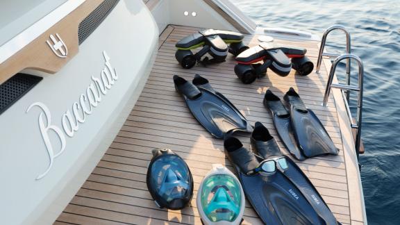 Among Monaco yacht rental options Baccarat motor yacht shows swim platform with snorkeling equipment.