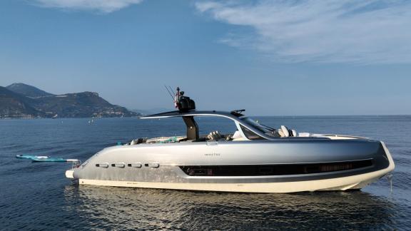Among Monaco yacht rental options Baccarat motor yacht is seen anchored with sleek design on calm sea.