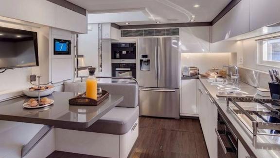 Stylish kitchen featuring modern stainless steel appliances and a cozy breakfast nook.