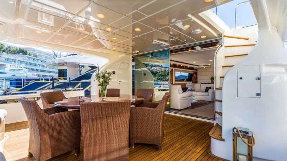 Stylish dining area on the motor yacht Katariina overlooking the harbor of Split, Croatia.