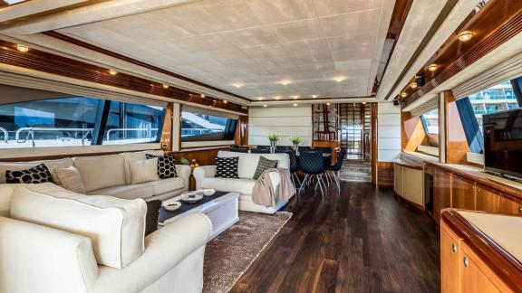 Elegant living room of the motor yacht Katariina with comfortable furnishings and panoramic windows in Croatia.