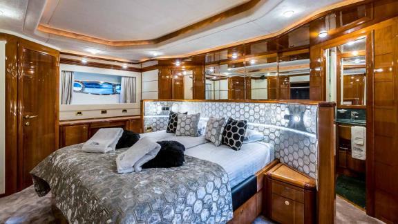 Elegant bedroom with king-size bed and stylish decor on the motor yacht Katariina in Croatia.