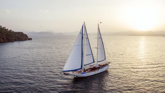 Enjoy the view of the Gulet Kayhan 5 at sunset at sea.