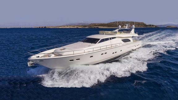 The Kentavros 2 yacht cruising swiftly through blue waters in this image.