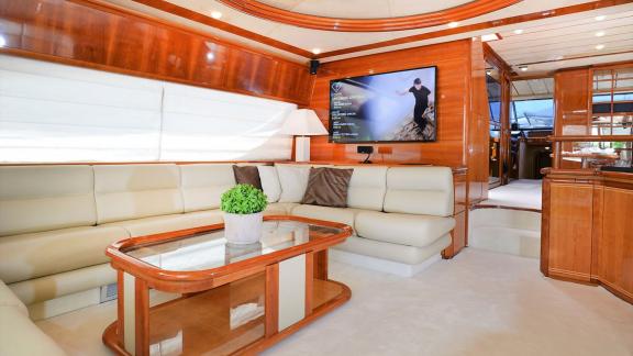 Spacious and comfortable living room on the yacht Kentavros 2, ideal for relaxing and watching TV.