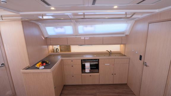 The modern kitchen on the Beluga 1 yacht features cooking and storage areas.