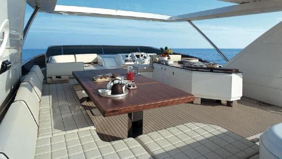 Luxurious outdoor dining area on motor yacht La Fenice, perfect for meals with a sea view.