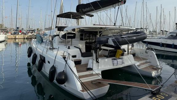 Among Athens bareboat catamaran charter options Bellatrix shows aft platform and easy water access.