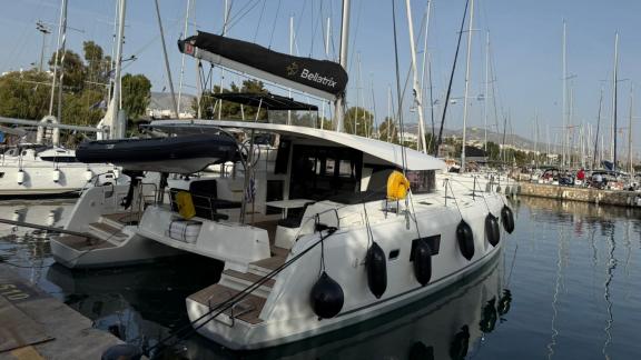 Among Athens bareboat catamaran charter options Bellatrix offers spacious deck and flexible sailing route.