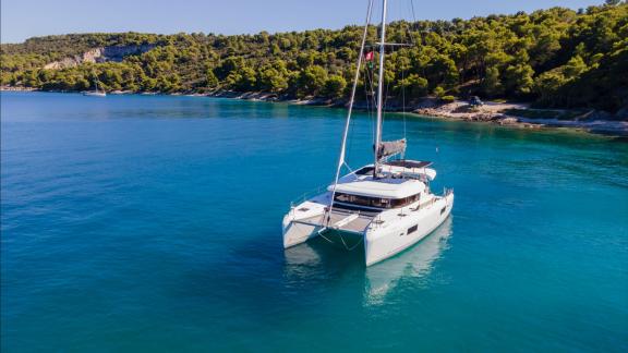 In Kastela bareboat catamaran charter Find Us with foredeck and spacious layout ideal for calm bay cruising.