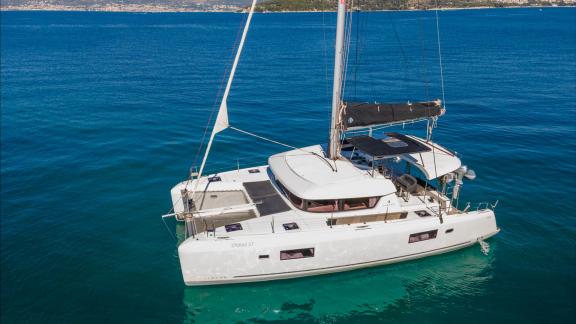 In Kastela bareboat catamaran charter Find Us with wide deck layout and spacious design ideal for blue cruise.