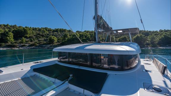 In Kastela bareboat catamaran charter Find Us with foredeck cushions and wide space ideal for sunbathing and relaxation.
