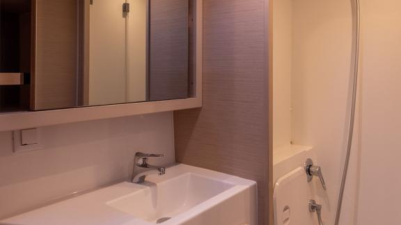 In Kastela bareboat catamaran charter Find Us bathroom with shower cabin, sink and compact layout for practical comfort.