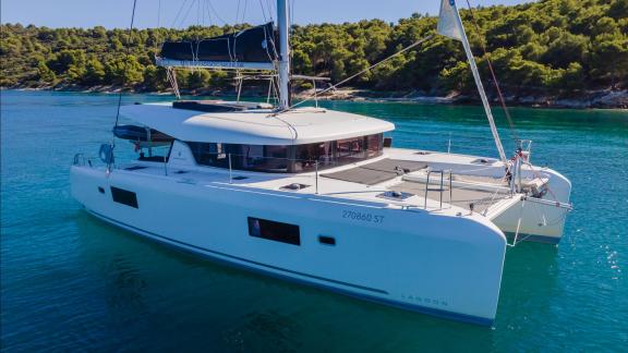 In Kastela bareboat catamaran charter Find Us with spacious deck and comfortable layout ideal for blue cruise.