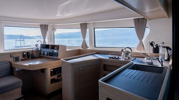 The modern kitchen area on Lyubushka offers comfortable yacht charter experiences in Montenegro.