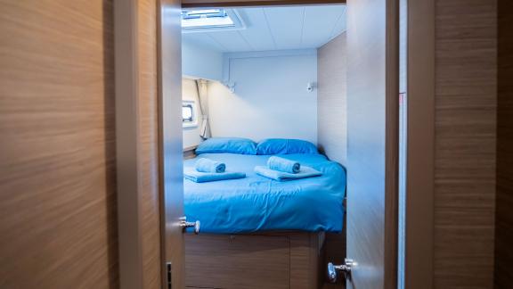 The simple cabin area on Lyubushka offers peaceful yacht charter experiences in Montenegro.