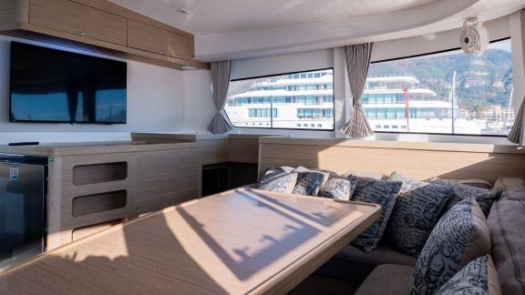 The spacious salon area on Lyubushka offers relaxing yacht charter moments in Montenegro.