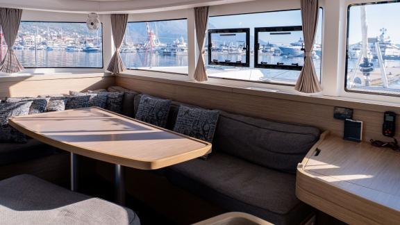 The spacious salon area on Lyubushka offers comfortable yacht charter moments in Montenegro.