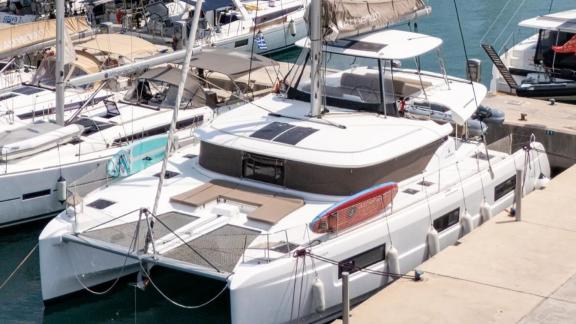 Among Rhodes catamaran charter options Escape 46 shows top view with wide deck and outdoor space.
