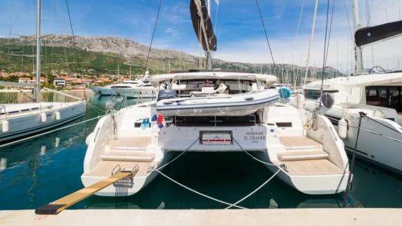 Lagoon 46 Madame El Grande showcases a spacious stern platform and tender storage area at Kastela Marina.