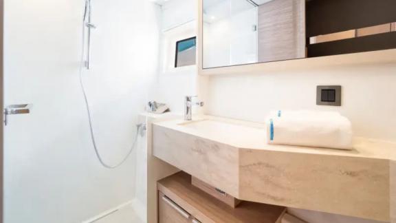 Lagoon 46 Madame El Grande features a private bathroom with a shower area, spacious vanity and modern finishes.