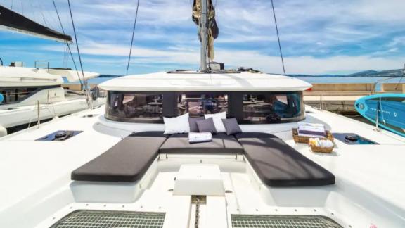 Lagoon 46 Madame El Grande offers comfortable foredeck loungers for relaxing during catamaran holidays from Kastela.