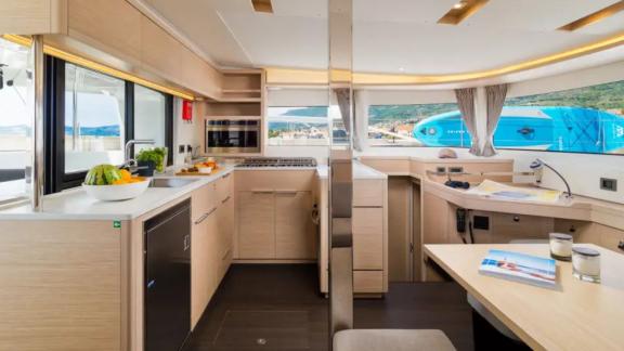 Lagoon 46 Madame El Grande features an open plan saloon and fully equipped galley with bright living spaces.