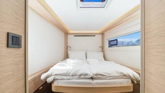 Lagoon 46 Madame El Grande features a guest cabin with a double bed, skylight and modern interior design.