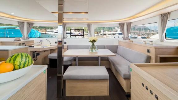 Lagoon 46 Madame El Grande features a bright dining and lounge area surrounded by panoramic windows.