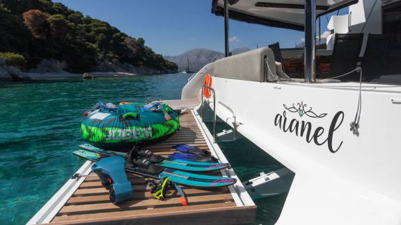 The swim platform of Aranel catamaran in Lefkada displays water toys and easy access to the sea.