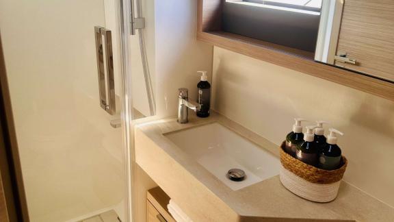 Eldamar’s bathroom features a spacious shower and elegant sink for comfort during charters in Trogir.