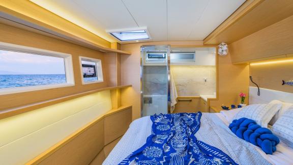 Largo Winch features a modern double guest cabin, offering a comfortable catamaran charter stay in Mykonos.